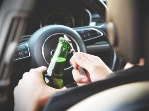Person Drinking At Wheel